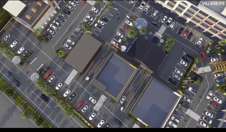 Aerial view of P-3 Village, a commercial property in Mohali, featuring retail shops, office spaces, and ample parking near Chandigarh.